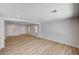 Bright, open-concept living room features recessed lighting and wood-look flooring at 4839 Englewood Ave, Las Vegas, NV 89139