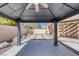 View of backyard from under the gazebo, showing patio and landscaping at 4925 Turtle Point Dr, Las Vegas, NV 89113