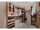 Spacious walk-in closet with custom shelving and ample storage space at 4925 Turtle Point Dr, Las Vegas, NV 89113