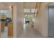 Bright hallway showcasing modern staircase, fireplace and tile flooring at 4925 Turtle Point Dr, Las Vegas, NV 89113