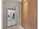 Hallway with wood floors and built-in cabinets leading into a bedroom with a view at 4925 Turtle Point Dr, Las Vegas, NV 89113