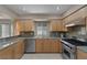 Kitchen showcasing stainless steel appliances, light wood cabinets, and granite countertops at 4925 Turtle Point Dr, Las Vegas, NV 89113