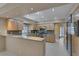 Kitchen featuring stainless steel appliances, light wood cabinets, and granite countertops at 4925 Turtle Point Dr, Las Vegas, NV 89113