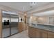 Kitchen featuring a large stainless steel refrigerator and granite countertops with custom wood cabinets at 4925 Turtle Point Dr, Las Vegas, NV 89113