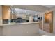 Kitchen featuring stainless steel appliances, light wood cabinets, and granite countertops at 4925 Turtle Point Dr, Las Vegas, NV 89113