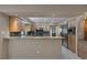 Kitchen featuring stainless steel appliances, light wood cabinets, and granite countertops at 4925 Turtle Point Dr, Las Vegas, NV 89113