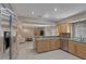 Bright kitchen featuring stainless steel appliances, light wood cabinets, and granite countertops at 4925 Turtle Point Dr, Las Vegas, NV 89113