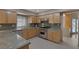 Kitchen featuring stainless steel appliances, light wood cabinets, and granite countertops at 4925 Turtle Point Dr, Las Vegas, NV 89113