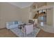 Inviting living room filled with natural light showcasing a staircase and neutral decor at 4925 Turtle Point Dr, Las Vegas, NV 89113