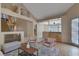 Spacious living room showcasing a wet bar, staircase, and neutral decor at 4925 Turtle Point Dr, Las Vegas, NV 89113