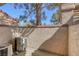 View of a patio with brick walls and trees in the background at 4925 Turtle Point Dr, Las Vegas, NV 89113