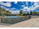 Well-maintained tennis court with stadium seating for spectators at 4925 Turtle Point Dr, Las Vegas, NV 89113