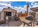 Shed, BBQ, and a small outdoor area surrounded by a backyard fence at 5125 Hallet Dr, Las Vegas, NV 89122