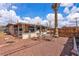 Home exterior shows access to the covered patio, gravel area, and well-defined yard space at 5125 Hallet Dr, Las Vegas, NV 89122