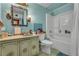 Bright bathroom with a classic vanity, toilet with a bidet and shower over tub at 5125 Hallet Dr, Las Vegas, NV 89122