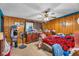 Bedroom featuring wooden paneled walls and ceiling fan at 5125 Hallet Dr, Las Vegas, NV 89122