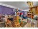 This bedroom is full of boxes, a purple wall, and a window air conditioner at 5125 Hallet Dr, Las Vegas, NV 89122