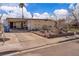 Single-story home featuring a covered carport and desert landscaping at 5125 Hallet Dr, Las Vegas, NV 89122