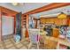 View of the kitchen featuring wood cabinets, checkered floors, and a cozy breakfast nook at 5125 Hallet Dr, Las Vegas, NV 89122