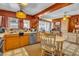 Bright kitchen with a combination of modern and traditional elements, wood cabinets, and natural light at 5125 Hallet Dr, Las Vegas, NV 89122