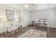 Bright bedroom with desk, chairs, modern ceiling fan, and bedside table at 513 Rafkin Pl, Henderson, NV 89052