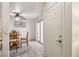 Inviting dining area with a ceiling fan, round table set, and sliding glass doors at 513 Rafkin Pl, Henderson, NV 89052