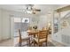 Comfortable dining area featuring a round wooden table and backyard access at 513 Rafkin Pl, Henderson, NV 89052