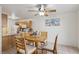 Cozy dining area featuring a round wooden table with seating for four at 513 Rafkin Pl, Henderson, NV 89052