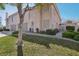 Inviting two-story home featuring lush greenery, a gated entrance, and a convenient two-car garage at 513 Rafkin Pl, Henderson, NV 89052