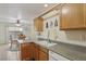 Kitchen featuring plenty of counter space with an adjacent dining area at 513 Rafkin Pl, Henderson, NV 89052