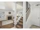 Inviting living room with a fireplace, plush carpet, and staircase access at 513 Rafkin Pl, Henderson, NV 89052