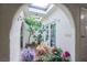 Bright atrium with seating, plants, and a skylight for a relaxing indoor/outdoor experience at 5323 Taravilla Cir, Las Vegas, NV 89146