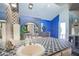 Unique bathroom featuring decorative blue tiles, a sink, and an open archway at 5323 Taravilla Cir, Las Vegas, NV 89146