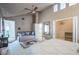 Bright main bedroom with ensuite bathroom, closet, and a view to the atrium at 5323 Taravilla Cir, Las Vegas, NV 89146