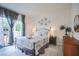 Relaxing main bedroom with a sliding glass door, neutral tones, and stylish accents at 5323 Taravilla Cir, Las Vegas, NV 89146