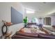 Comfortable living room with modern furniture and a view of the atrium with a piano at 5323 Taravilla Cir, Las Vegas, NV 89146