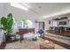 Inviting living room with a piano, atrium view, and access to the dining room at 5323 Taravilla Cir, Las Vegas, NV 89146