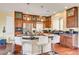 Well-equipped kitchen with a granite island, stainless steel appliances, and hardwood flooring at 5850 Sonoma Station Ave, Las Vegas, NV 89139