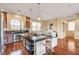 Spacious kitchen with hardwood floors, a center island with seating, and stainless steel appliances at 5850 Sonoma Station Ave, Las Vegas, NV 89139