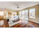 Bright and open-concept living room featuring hardwood floors, a modern sectional sofa, and natural light at 5850 Sonoma Station Ave, Las Vegas, NV 89139