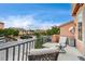 Relaxing upper patio seating overlooking the quiet neighborhood street at 5850 Sonoma Station Ave, Las Vegas, NV 89139