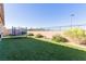 Well-maintained backyard with artificial turf, trampoline, and secure fencing at 6156 Ava Ridge Ave, Las Vegas, NV 89141