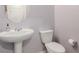 Powder bathroom featuring a pedestal sink, toilet, and neutral paint at 6156 Ava Ridge Ave, Las Vegas, NV 89141