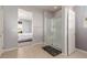 Bathroom showcasing tile flooring, a walk-in shower, and passage to the main bedroom at 6156 Ava Ridge Ave, Las Vegas, NV 89141