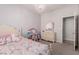 Cozy bedroom featuring a charming unicorn-themed bedspread and a decorative chandelier at 6156 Ava Ridge Ave, Las Vegas, NV 89141