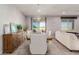 Elegant dining room featuring a modern chandelier and sliding glass doors to the backyard at 6156 Ava Ridge Ave, Las Vegas, NV 89141