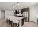 Spacious kitchen with a large island, stainless steel appliances, and sleek cabinetry at 6156 Ava Ridge Ave, Las Vegas, NV 89141