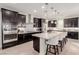 Modern kitchen featuring stainless steel appliances, a center island with seating, and pendant lighting at 6156 Ava Ridge Ave, Las Vegas, NV 89141