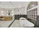 Elegant bathroom features a freestanding tub, a glass shower, and stylish fixtures at 62 Incline Village Ct, Henderson, NV 89074