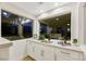 Modern wet bar features white cabinetry, dual windows with lovely outdoor views, and stylish fixtures at 62 Incline Village Ct, Henderson, NV 89074